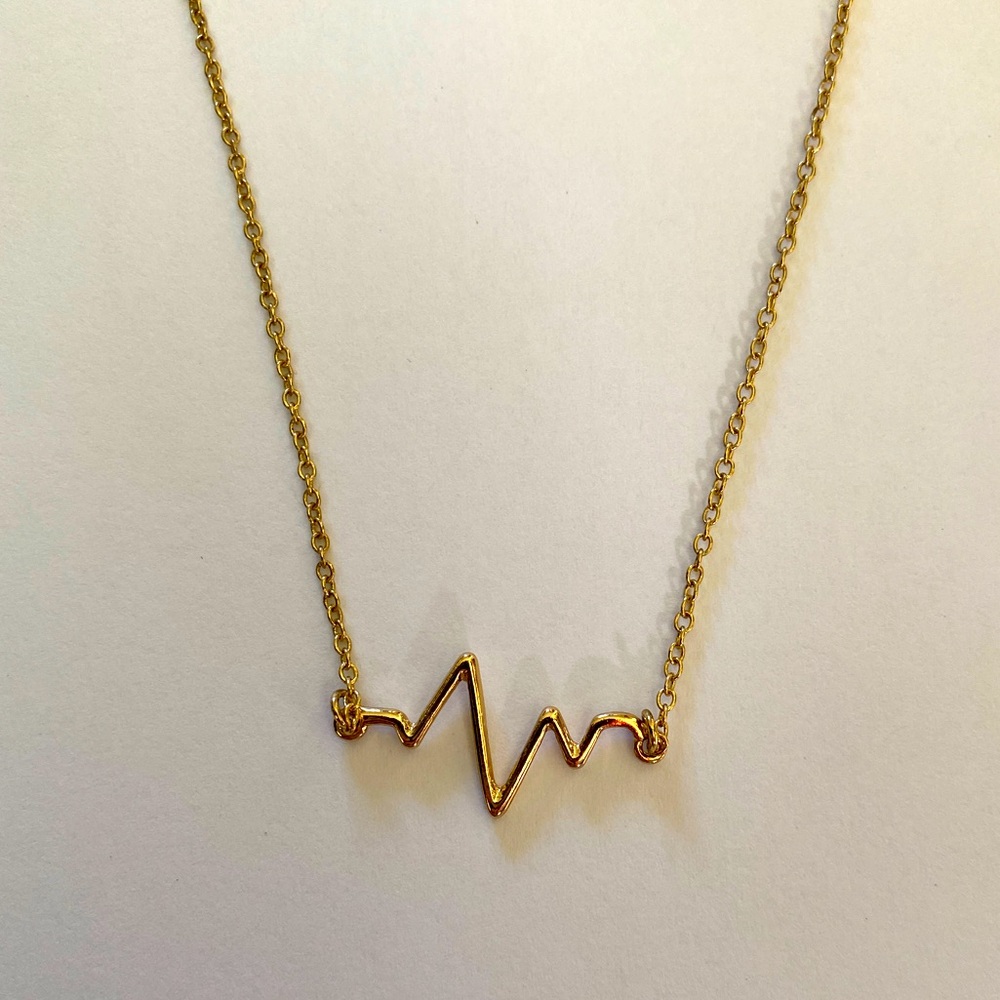 Delicate gold heartbeat necklace